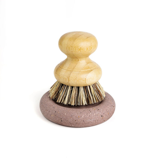 Wood Scrub Brush In A Concrete Dish