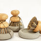 Wood Scrub Brush In A Concrete Dish