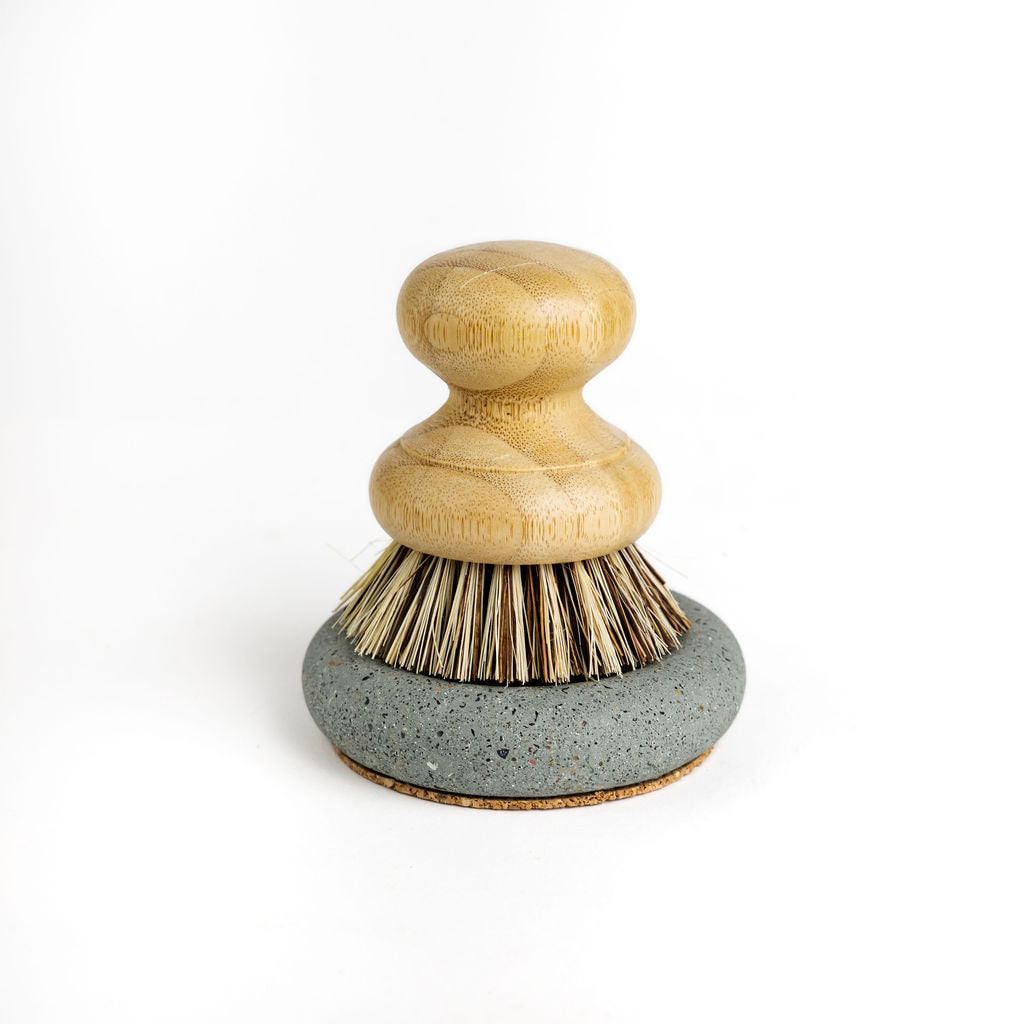 Wood Scrub Brush In A Concrete Dish