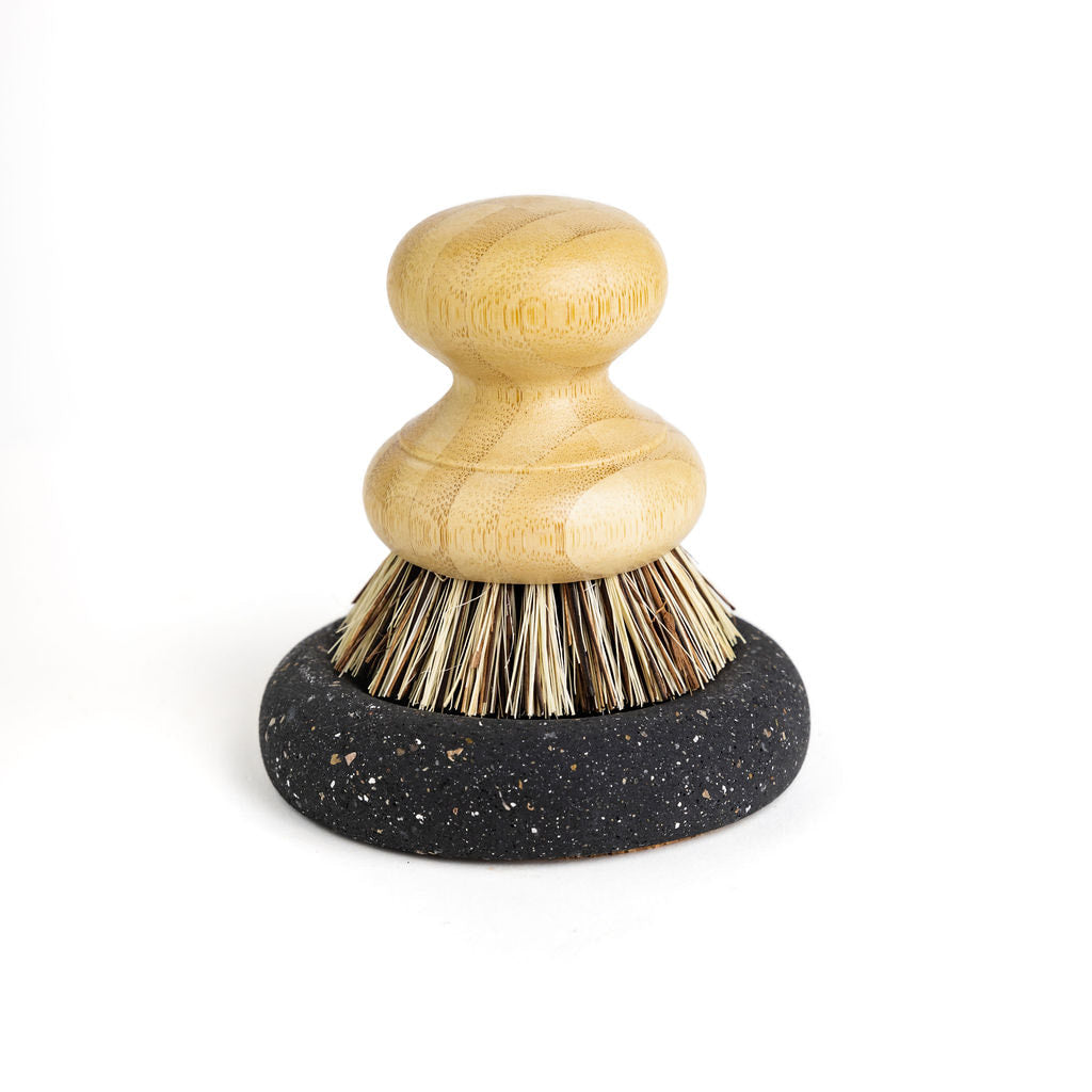 Wood Scrub Brush In A Concrete Dish