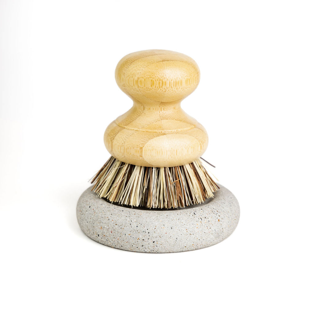 Wood Scrub Brush In A Concrete Dish