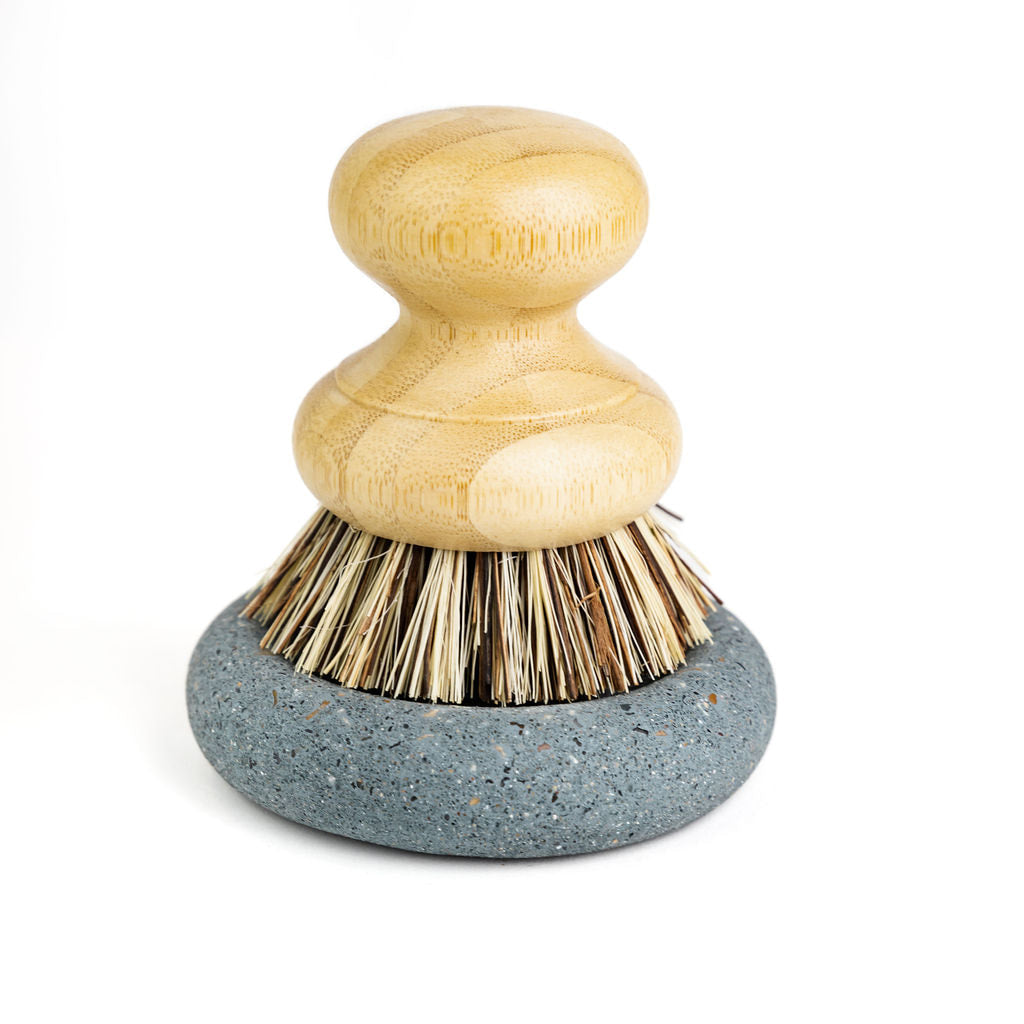 Wood Scrub Brush In A Concrete Dish