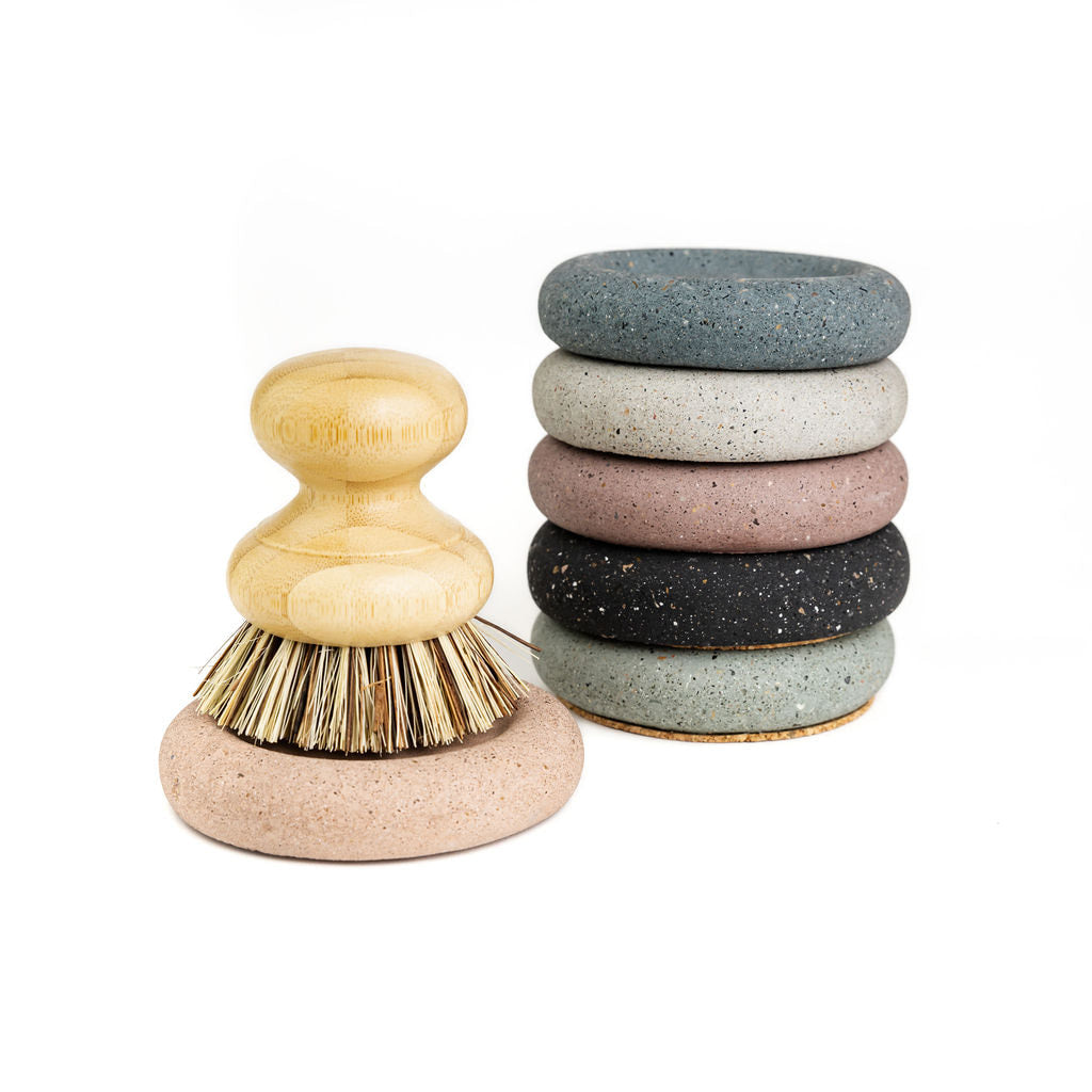 Wood Scrub Brush In A Concrete Dish