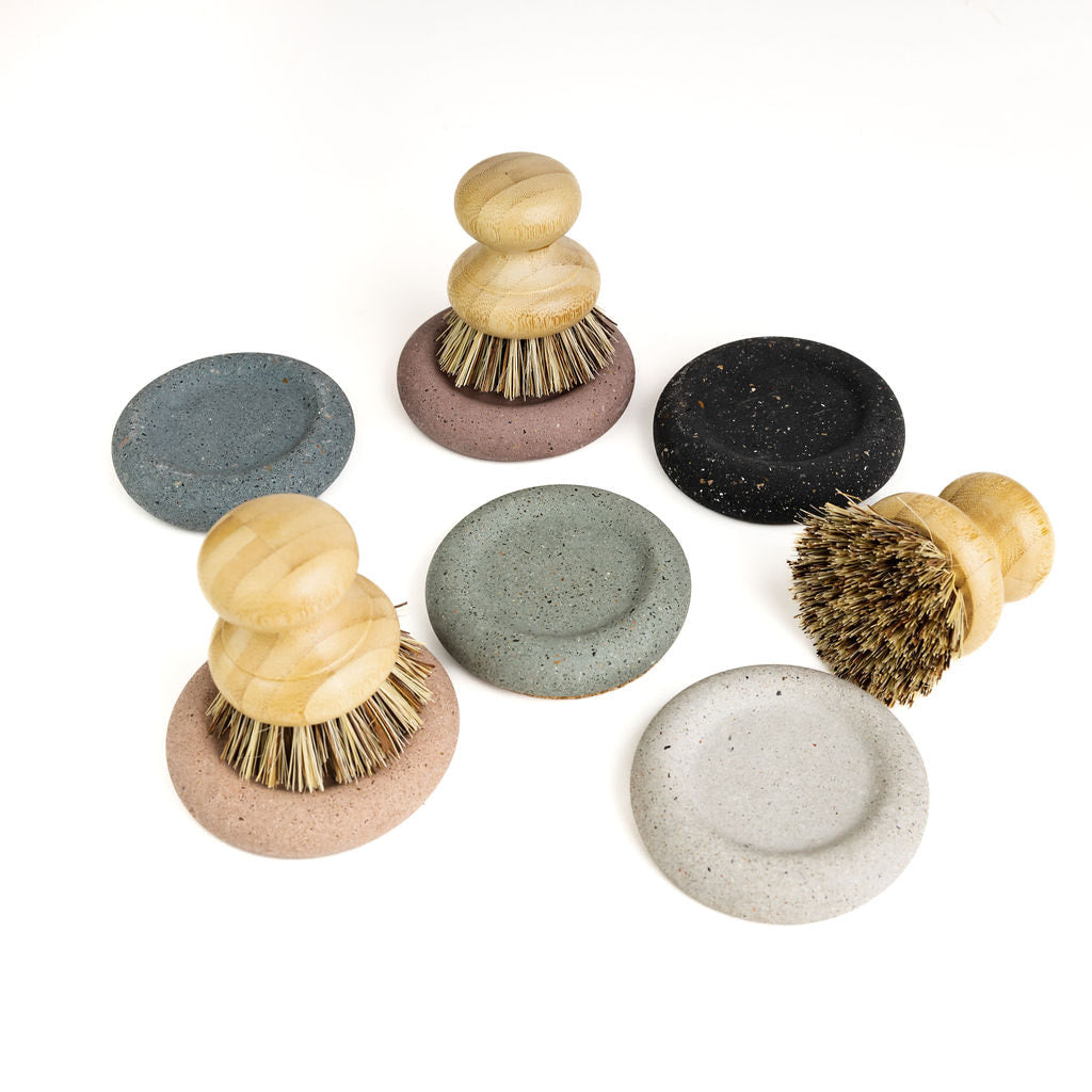Wood Scrub Brush In A Concrete Dish